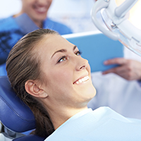 Smiling woman relaxed in dental chair