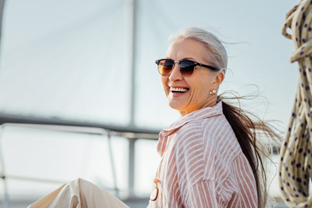 Woman smiling while out on her boat