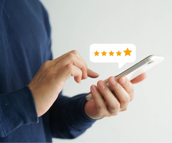 Man checking five star dental review in Arlington