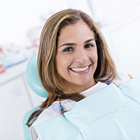 Young smiling woman in dental office