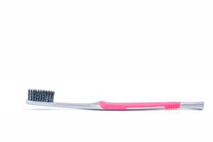 toothbrush with charcoal on bristles