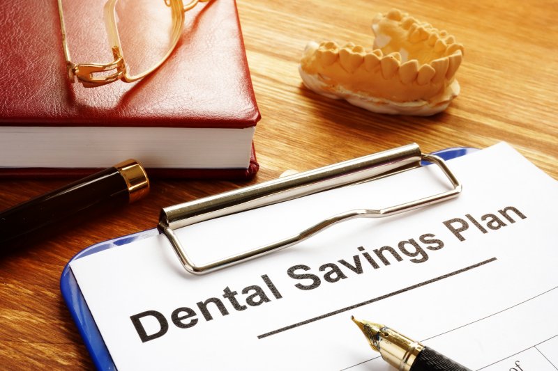 clipboard with Dental Savings Plan information