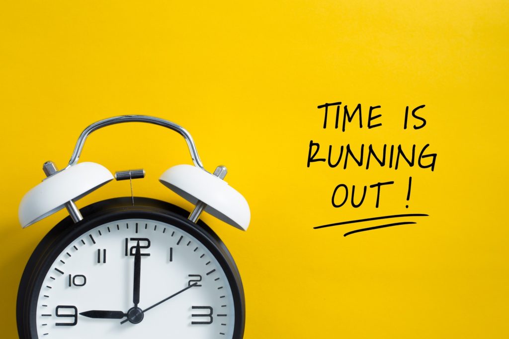 Time is running out text next to ticking clock