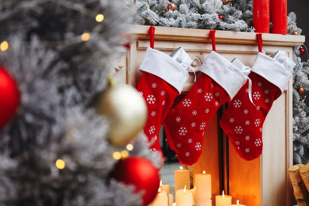 Christmas stockings hung over a fireplace