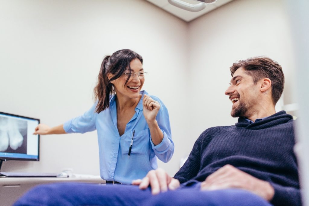 Dentist explaining X-ray to patient